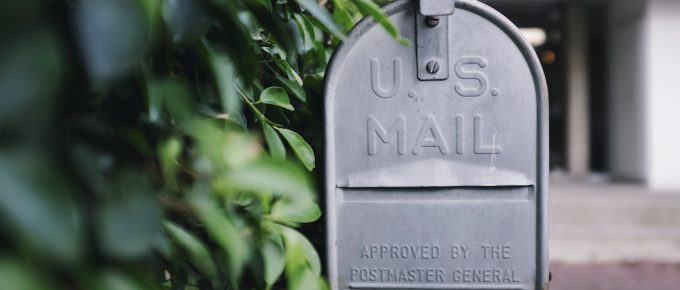 mailbox next to bushes